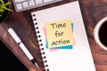 Sticky note with text Time for action on top of desk Royalty Free Stock Photo