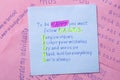 Sticky note with text to be happy you must