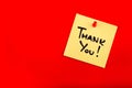 Sticky Note with Words `Thank You!` on Red Royalty Free Stock Photo