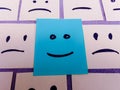 sticky notes with All sad and one Happy face - Unhappy and Happy Team Concept Royalty Free Stock Photo