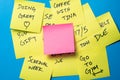 Sticky Notes on a Blue Wall with Blank Pink Note Royalty Free Stock Photo