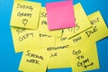 Sticky Notes on a Blue Wall with Blank Pink Note Royalty Free Stock Photo