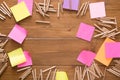 Sticky notes and color pencils on wooden desk Royalty Free Stock Photo