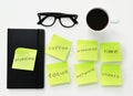 Sticky notes with different work concepts on an office desk Royalty Free Stock Photo
