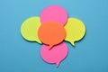 Sticky notes in the shape of speech balloons Royalty Free Stock Photo