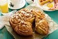 Sticky pecan buns on breakfast table Royalty Free Stock Photo