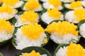 Sticky rice in coconut cream topping with egg yolk fudge balls.