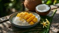 Sticky rice and mango harmony of textures. Glowing yellow mango slices atop sweet, glutinous rice