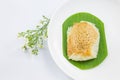 Sticky rice with steamed custard on banana leaves and dish with flower Royalty Free Stock Photo
