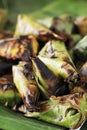 Sticky rice wrapped in banana leaves grill Royalty Free Stock Photo