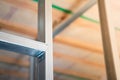 Stiffening ribs in a metal profile frame in a plasterboard wall close-up. Building a wall in a private house