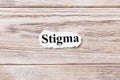 Stigma of the word on paper. concept. Words of Stigma on a wooden background Royalty Free Stock Photo