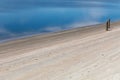 Still blue bay waters at low tide, barnacle encrusted posts, Tybee Island Georgia USA Royalty Free Stock Photo