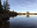 Glass like view of the water of Lake of the Woods Royalty Free Stock Photo