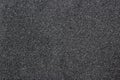 Still dark black paper texture background with clearly detailed natural grain noise texture effect.