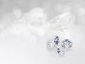 still with expensive cut diamonds in front of a white background, reflections on the ground. Lot of copy space Royalty Free Stock Photo