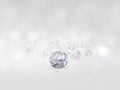 Still with expensive cut diamonds in front of a white background, reflections on the ground. Lot of copyspace Royalty Free Stock Photo