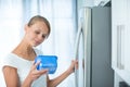 Is this still fine? Pretty, young woman in her kitchen Royalty Free Stock Photo