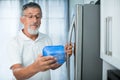 Is this still fine? Senior man in his kitchen Royalty Free Stock Photo