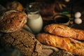 Still life. Agricultural products: eggs, milk, fresh bread on a wooden table. Close-up One trick Royalty Free Stock Photo