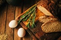 Still life. Agricultural products: eggs, milk, fresh bread on a wooden table. Close-up One trick Royalty Free Stock Photo