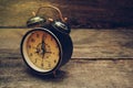 Still life with alarm clock on wood table. Royalty Free Stock Photo