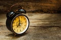 Still life with alarm clock on wood table. Royalty Free Stock Photo