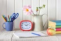 Still life with an album, alarm clock, Apple and textbooks Royalty Free Stock Photo