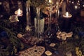 Still life with alchemy ritual objects, old bottles, herbs and black candles Royalty Free Stock Photo