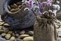 Still life. Almond nuts in a clay pot on a wooden table closeup