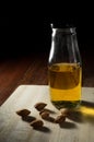 Still life Almond oil bottle on wooden table.