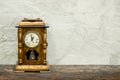 still life of antique clock on woolden plank and old concrete te Royalty Free Stock Photo