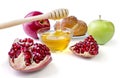 Still life appetizing challah, apples, pomegranate and bowl of h Royalty Free Stock Photo