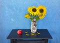 Still life with apple and sunflowers Royalty Free Stock Photo