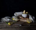 Still life with apples, apple juice, old books and a silver knife on a wooden table on a dark background. vintage Royalty Free Stock Photo