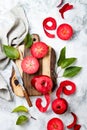 Still life with apples on wooden board over white marble table, top view. Fresh red apples Baya Marisa. Royalty Free Stock Photo