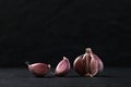 A still life arrangement of Three whole garlic bulbs grouped on Royalty Free Stock Photo