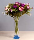 Glass vase artificial flowers Royalty Free Stock Photo