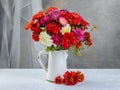 still life autumn bouquet on the table. zinnias asters marigolds in a vase Royalty Free Stock Photo