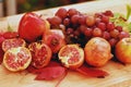 Still life of autumn fruits, with apples, grapes and pomegranate Royalty Free Stock Photo