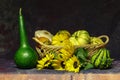 Still life of autumn pumpkins in a wicker basket Royalty Free Stock Photo