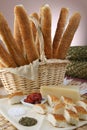 Still life baguette with oregano and cheese. basket with bread sticks Royalty Free Stock Photo