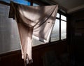 Still life on the balcony. The shirt is dried on a rope