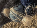 Still life of balls of yarn, woolen and acrylic threads, knitting needles, knitted products. Soft light from the window. Knitting Royalty Free Stock Photo