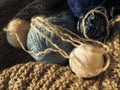 Still life of balls of yarn, woolen and acrylic threads, knitting needles, knitted products. Soft light from the window. Knitting Royalty Free Stock Photo