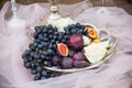 Still life: basket with grapes, figs and plums Royalty Free Stock Photo