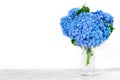 Still life with a beautiful bouquet of blue hydrangea flowers. holiday or wedding background with copy space Royalty Free Stock Photo