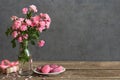 Still life with a beautiful bouquet of pink roses flowers, macarons and gift box. holiday or wedding background Royalty Free Stock Photo