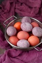 Still life of beautiful textured purple eggs in the sieve Royalty Free Stock Photo