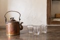 Vintage brass tea pot with empty glasses Royalty Free Stock Photo